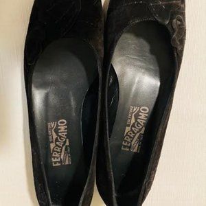 Salvatore Ferragamo black flat suede shoes.